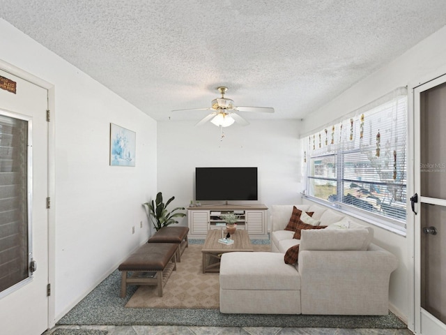 7037 Versailles N Unit 15, Pinellas Park, FL 33781 - living area featuring a ceiling fan and a textured ceiling
