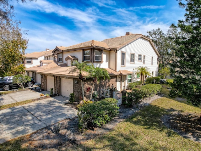 1203 Clays Trl Unit 406, Oldsmar, FL 34677 - multi unit property featuring an attached garage, a chimney, concrete driveway, and a tiled roof