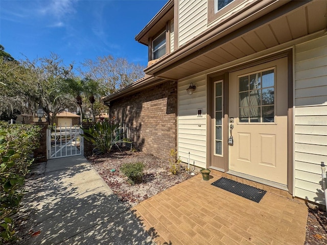 1203 Clays Trl Unit 406, Oldsmar, FL 34677 - entrance to property featuring a gate and brick siding
