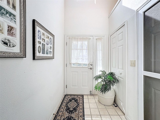 1203 Clays Trl Unit 406, Oldsmar, FL 34677 - doorway to outside featuring baseboards and light tile patterned floors