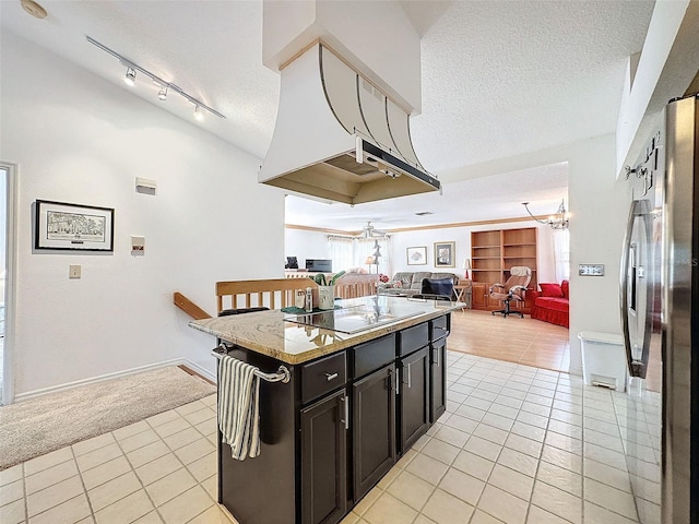 1203 Clays Trl Unit 406, Oldsmar, FL 34677 - kitchen featuring open floor plan, light tile patterned floors, a textured ceiling, and black electric cooktop