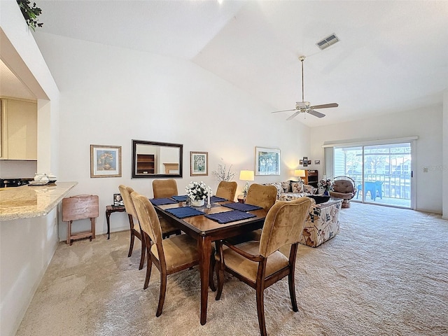 1203 Clays Trl Unit 406, Oldsmar, FL 34677 - dining area featuring light carpet, high vaulted ceiling, ceiling fan, and visible vents