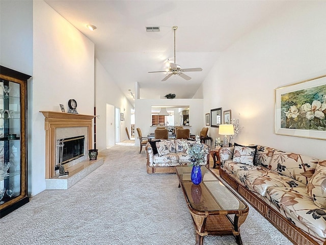 1203 Clays Trl Unit 406, Oldsmar, FL 34677 - living room featuring high vaulted ceiling, carpet flooring, a ceiling fan, visible vents, and a high end fireplace