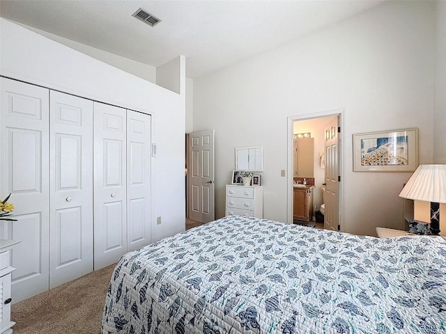 1203 Clays Trl Unit 406, Oldsmar, FL 34677 - bedroom with high vaulted ceiling, connected bathroom, carpet floors, visible vents, and a closet