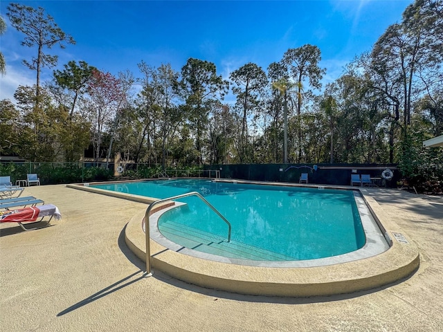 1203 Clays Trl Unit 406, Oldsmar, FL 34677 - community pool featuring fence and a patio