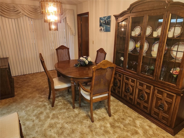 dining space with light carpet