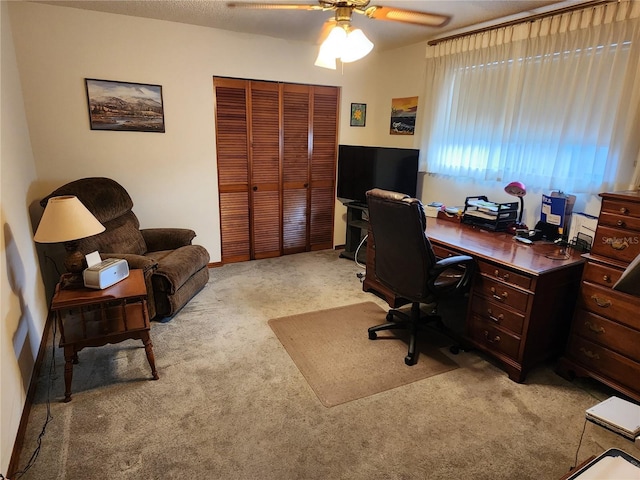 office featuring light colored carpet and ceiling fan