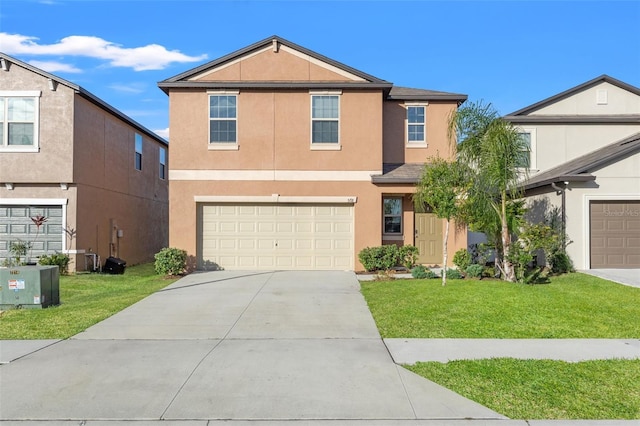 view of property featuring a garage and a front lawn