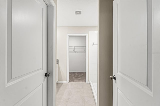 interior space featuring tile patterned flooring and a shower