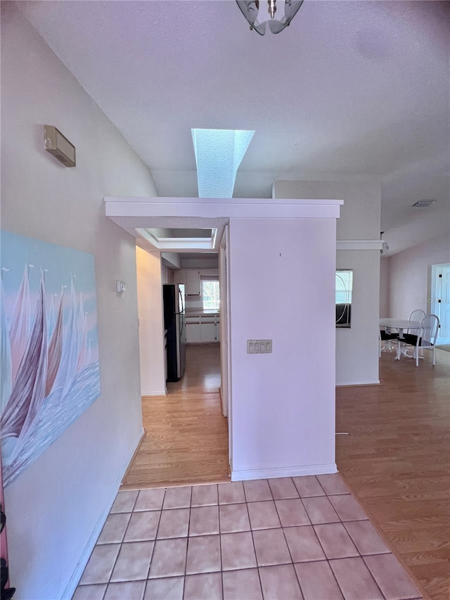 hallway with light wood-type flooring