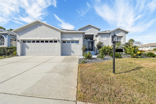 single story home with a garage and a front yard