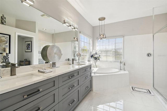 bathroom with vanity and separate shower and tub