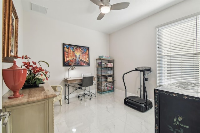 office space featuring ceiling fan and radiator