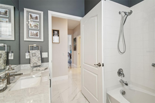 bathroom featuring vanity and tiled shower / bath combo