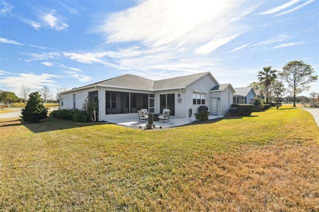 back of house with a patio, a sunroom, and a yard