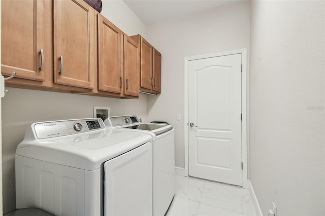 laundry room with cabinets and independent washer and dryer