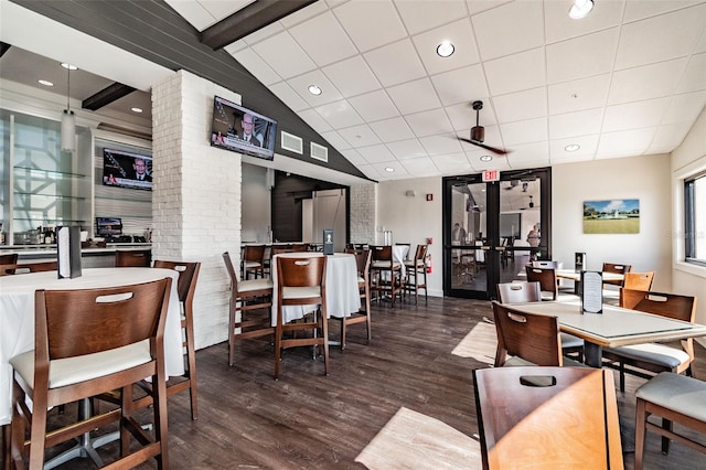 dining area with french doors, dark hardwood / wood-style floors, and lofted ceiling with beams