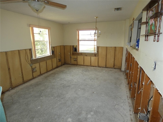 unfurnished room with ceiling fan