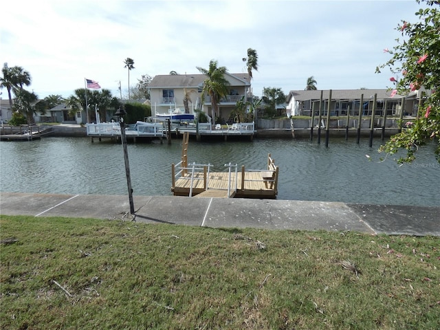 13737 Michelle Ave, Hudson, FL 34667 - dock area with a water view, a lawn, and a residential view