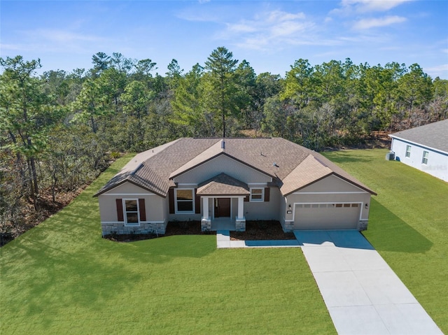 view of front of home with a garage and a front yard