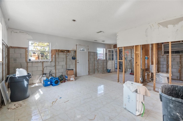 basement featuring a textured ceiling