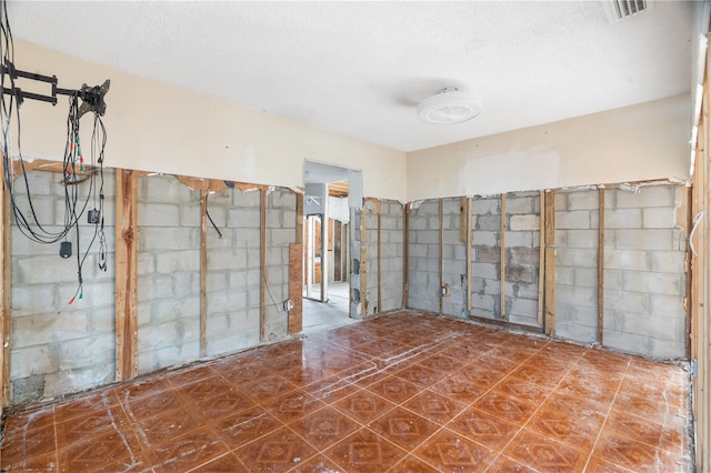 empty room featuring a textured ceiling