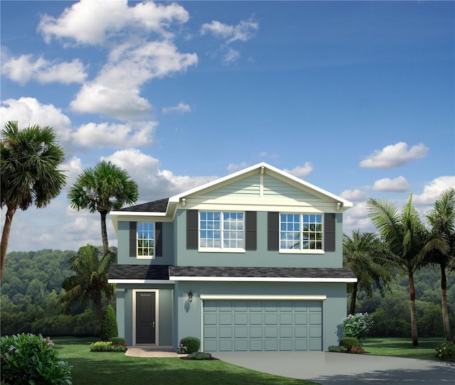 view of property featuring a garage and a front lawn