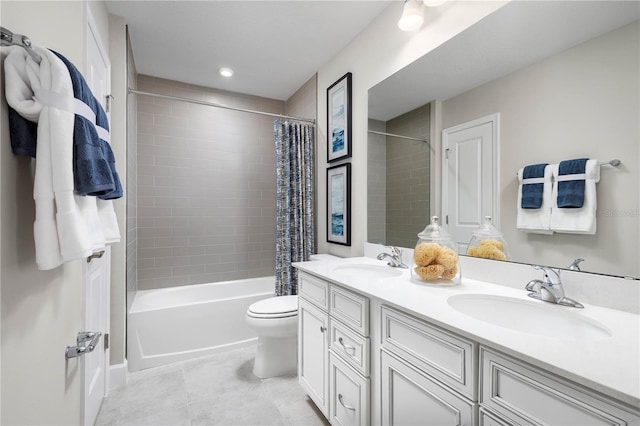 full bathroom with tile patterned flooring, vanity, shower / tub combo, and toilet