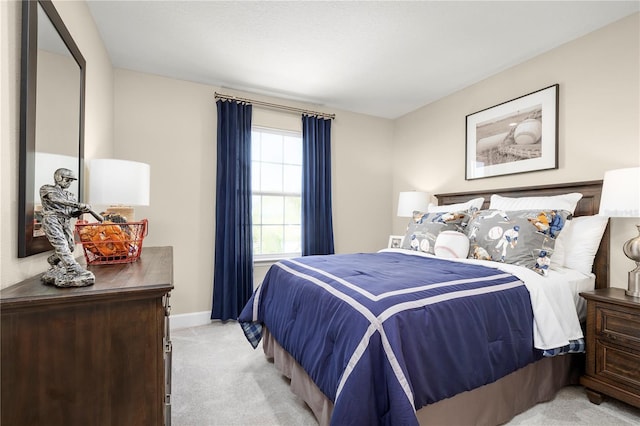 bedroom featuring light carpet