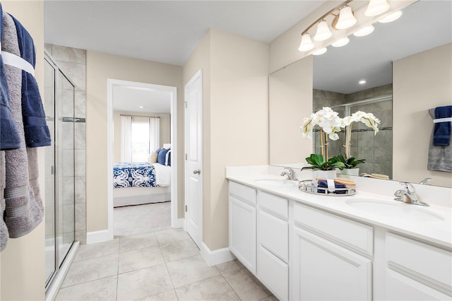 bathroom with tile patterned floors, a shower with shower door, and vanity