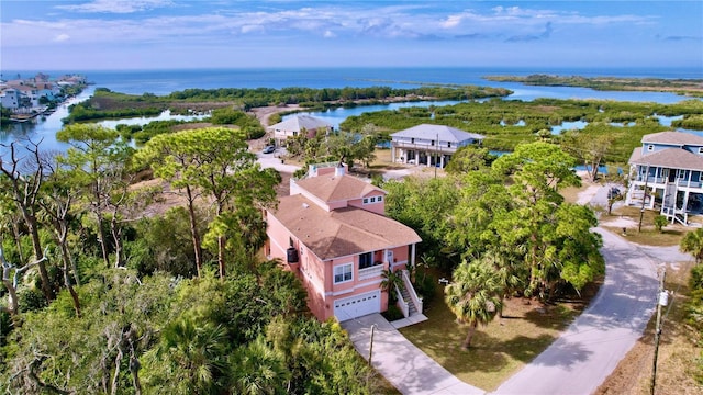 birds eye view of property featuring a water view