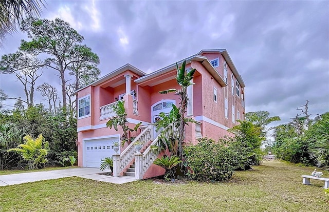 view of front of house with a garage and a front yard