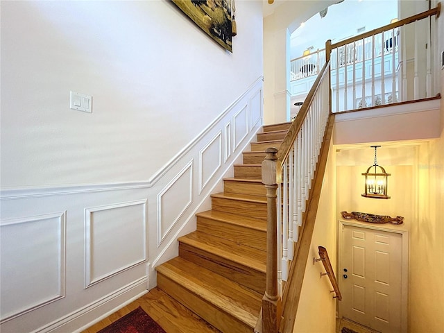 stairway featuring hardwood / wood-style floors