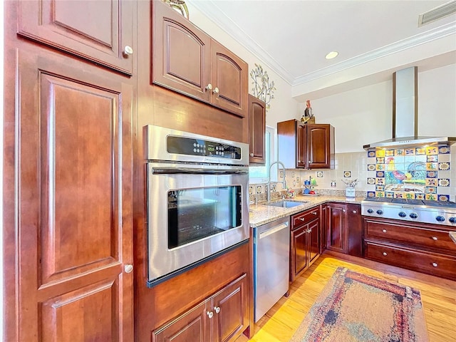 kitchen with sink, stainless steel appliances, ornamental molding, light stone countertops, and decorative backsplash