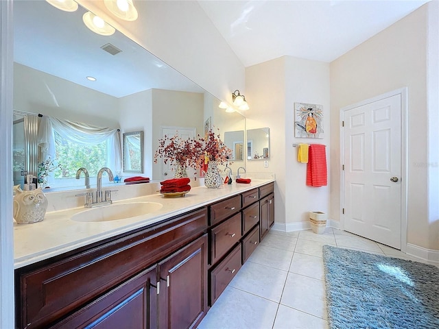 bathroom with tile patterned flooring and vanity