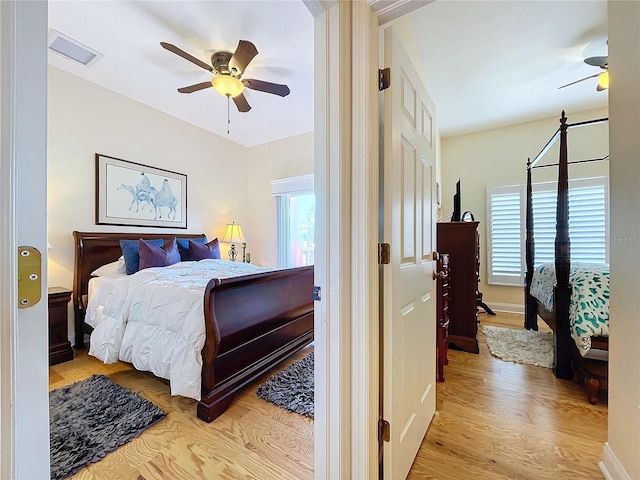 bedroom featuring ceiling fan and light wood-type flooring