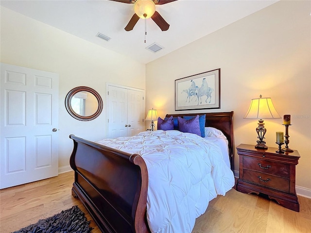 bedroom with ceiling fan, a closet, and light wood-type flooring