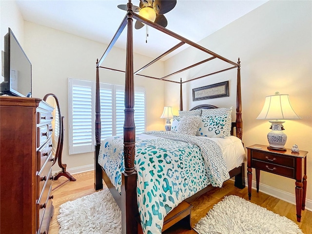 bedroom with hardwood / wood-style flooring and ceiling fan