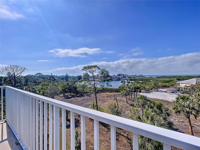 balcony featuring a water view