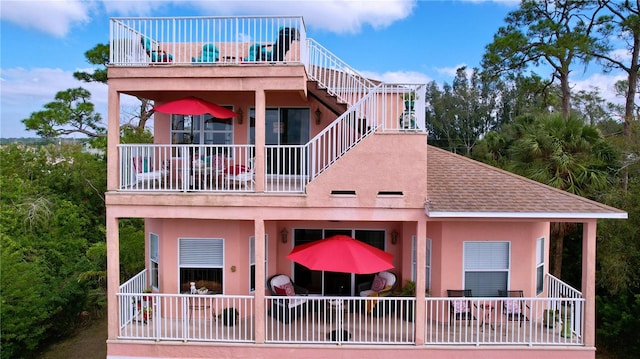 rear view of house with a balcony