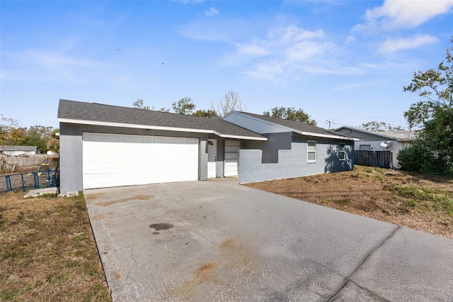 ranch-style home featuring a garage