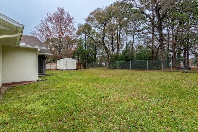 view of yard with a storage unit