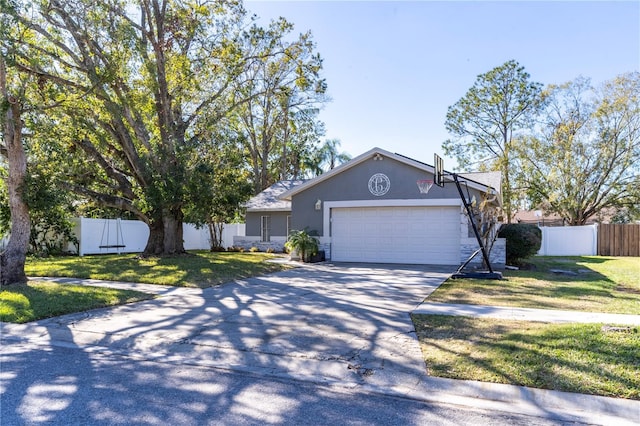 single story home featuring a garage and a front yard