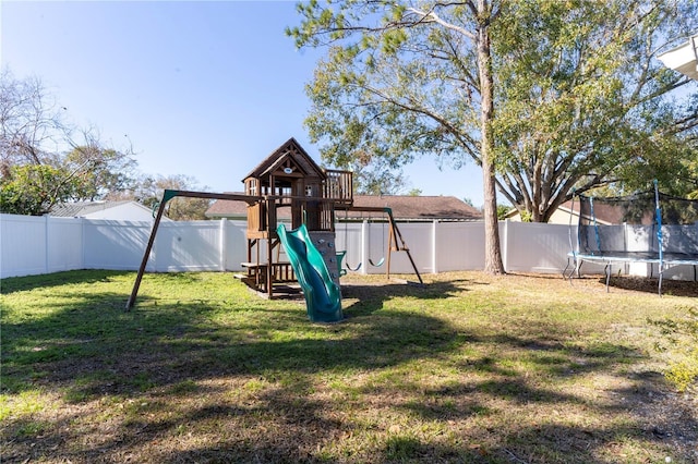 view of jungle gym featuring a trampoline and a yard