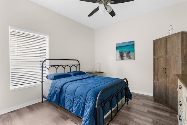 bedroom featuring hardwood / wood-style floors and ceiling fan