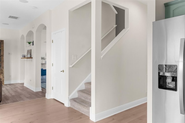 staircase featuring hardwood / wood-style floors