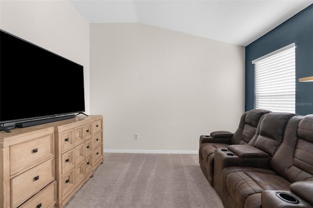 living room with light colored carpet and lofted ceiling