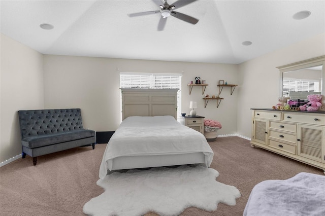 carpeted bedroom featuring vaulted ceiling and ceiling fan