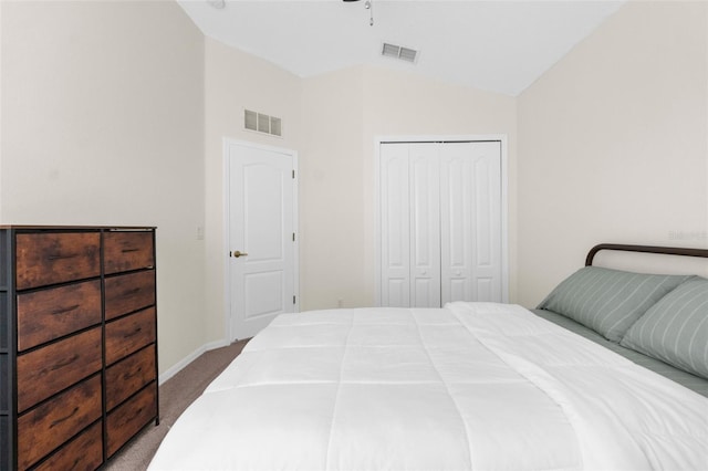 carpeted bedroom featuring ceiling fan, vaulted ceiling, and a closet