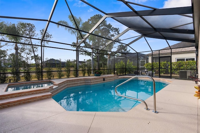 view of swimming pool with an in ground hot tub, a lanai, a patio, and central air condition unit